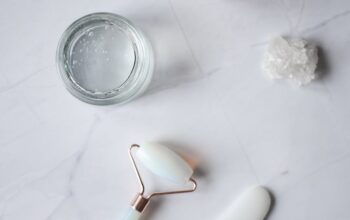 spa supplies for skincare procedures placed on marble table