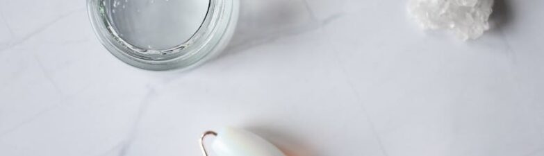 spa supplies for skincare procedures placed on marble table