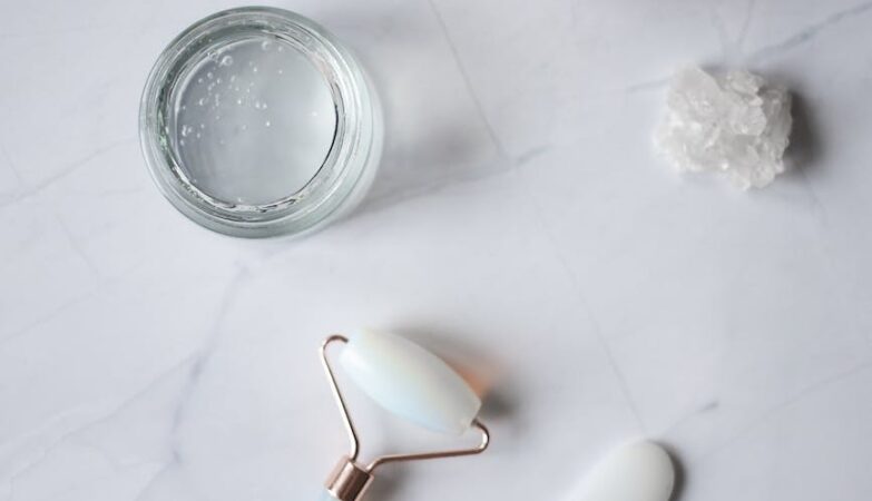 spa supplies for skincare procedures placed on marble table