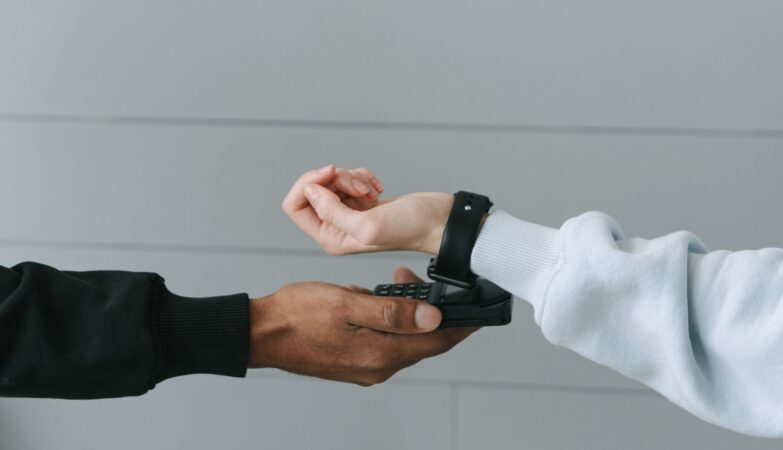 person paying using her smartwatch